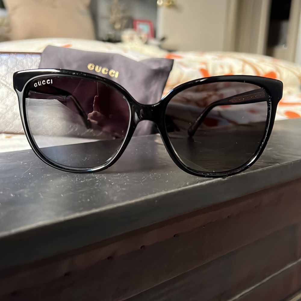 Gucci black sunglasses with gold logo